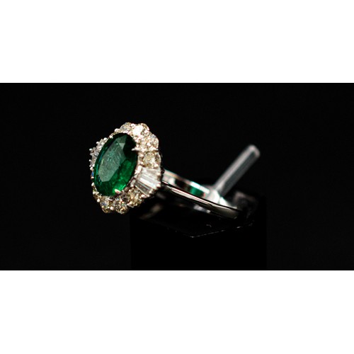 30 - 18CT WHITE GOLD RING SET, with an oval-cut emerald surrounded by a halo of diamonds, emerald 1.38ct,... 