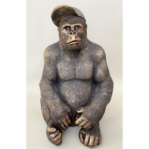 520 - GORILLA WITH BASEBALL CAP, resin with painted finish, 58cm x 40cm x 34cm.