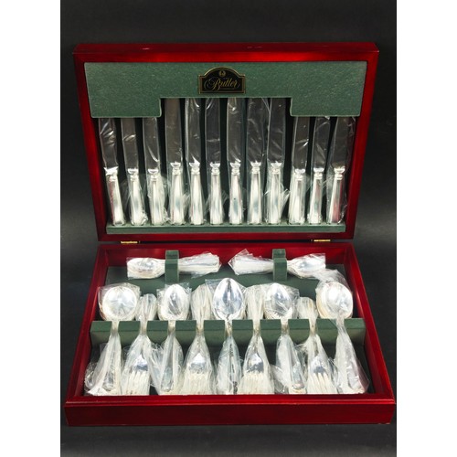 26 - GEORGE BUTLER BOXED CANTEEN OF CUTLERY, an embossed silver dressing table set and a boxed set of sil... 