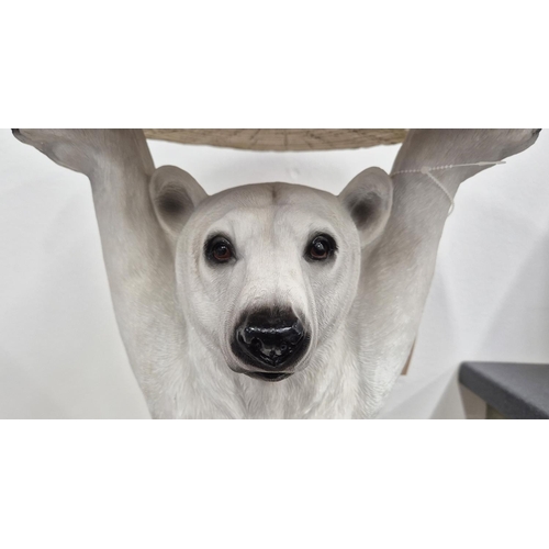 373 - SIDE TABLE, in the form of a polar bear, polychrome resin, 52cm H x 34cm diam approx.