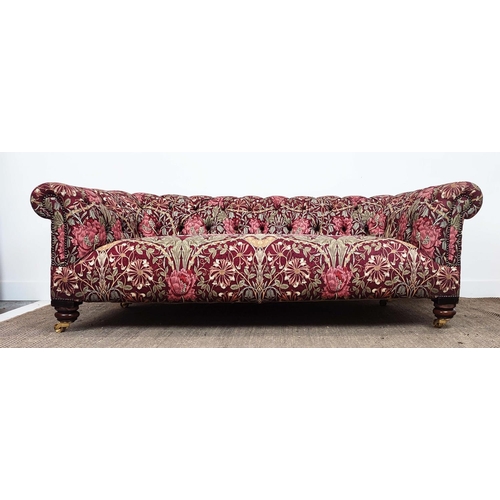 159 - CHESTERFIELD SOFA, Victorian style in maroon William and Morris patterned fabric on brass castors, 6... 