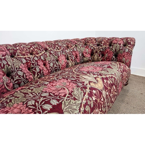 159 - CHESTERFIELD SOFA, Victorian style in maroon William and Morris patterned fabric on brass castors, 6... 