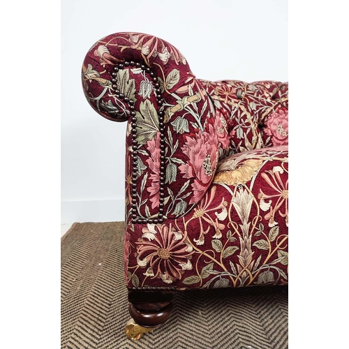 159 - CHESTERFIELD SOFA, Victorian style in maroon William and Morris patterned fabric on brass castors, 6... 