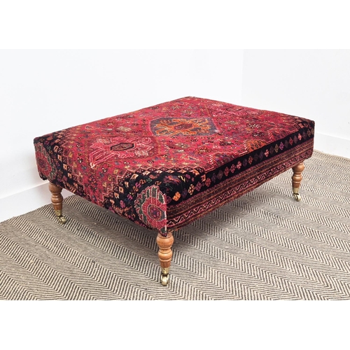 193 - HEARTH STOOL, rectangular red carpet upholstered on beech legs and brass castors, 43cm H x 105cm W x... 