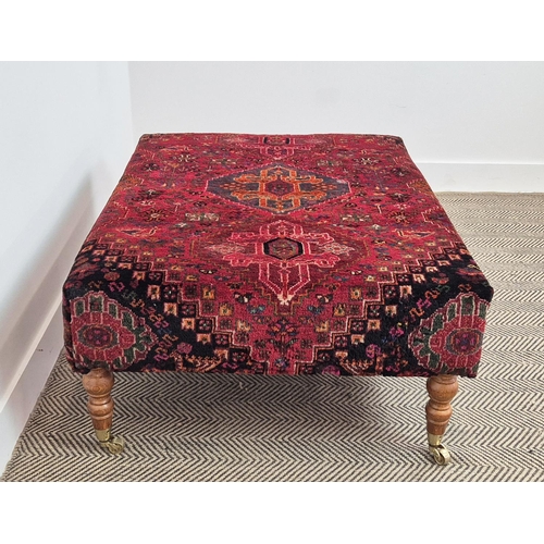 193 - HEARTH STOOL, rectangular red carpet upholstered on beech legs and brass castors, 43cm H x 105cm W x... 