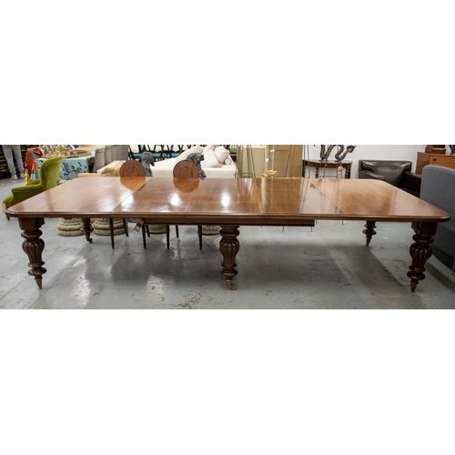 194 - DINING TABLE, Victorian mahogany with three extra leaves on six lobed baluster legs and brass castor... 