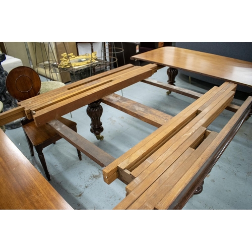 194 - DINING TABLE, Victorian mahogany with three extra leaves on six lobed baluster legs and brass castor... 