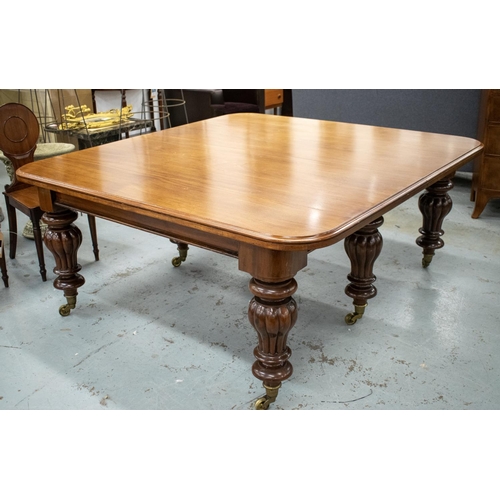 194 - DINING TABLE, Victorian mahogany with three extra leaves on six lobed baluster legs and brass castor... 