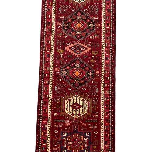 105 - PERSIAN KARAJA RUNNER, 485cm x 90cm.