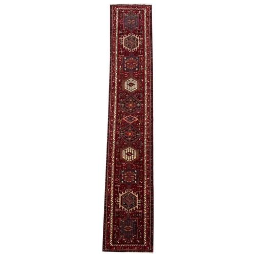 105 - PERSIAN KARAJA RUNNER, 485cm x 90cm.