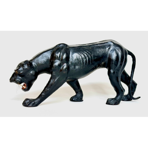 260 - LIBERTY STYLE PANTHER, in the manner of Liberty of London leather covered, 70cm W x 34cm H.