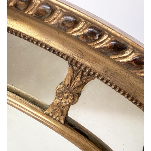 214 - WALL MIRROR, early 20th century George III design oval carved giltwood and gesso, moulded with bevel... 