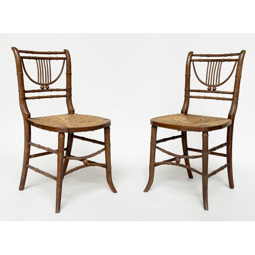 204 - SIDE CHAIRS, a pair, Regency faux bamboo each with lyre backs, woven rush seats and swept supports, ... 