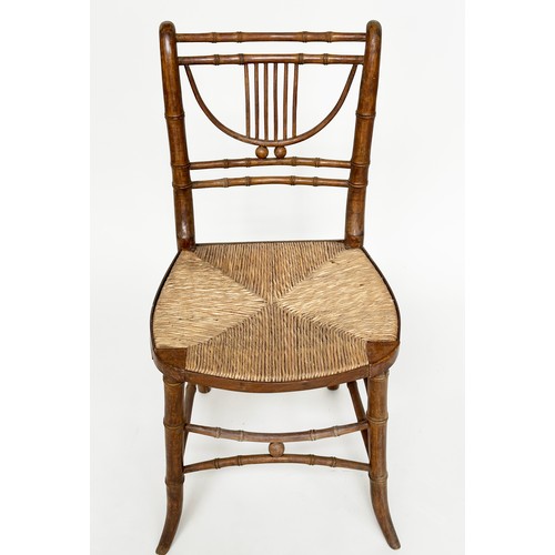 204 - SIDE CHAIRS, a pair, Regency faux bamboo each with lyre backs, woven rush seats and swept supports, ... 