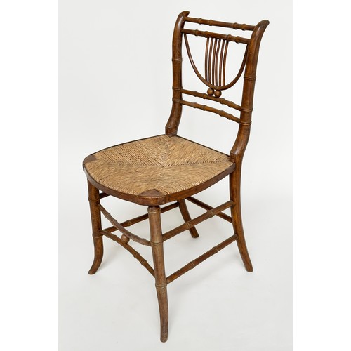 204 - SIDE CHAIRS, a pair, Regency faux bamboo each with lyre backs, woven rush seats and swept supports, ... 