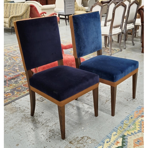 DINING CHAIRS,  a set of ten in differing shades of blue velvet, some navy blue with wooden frame and contrasting brown feet detail, each 101cm H x 52cm W. (10)