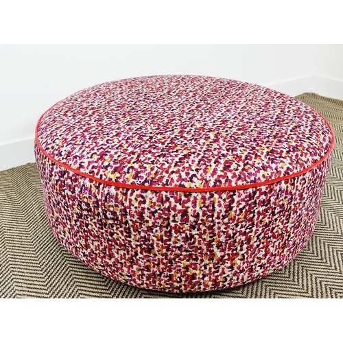 368 - FOOTSTOOL, circular in a patterned chenille with piping detail, 90cm x 40cm H.