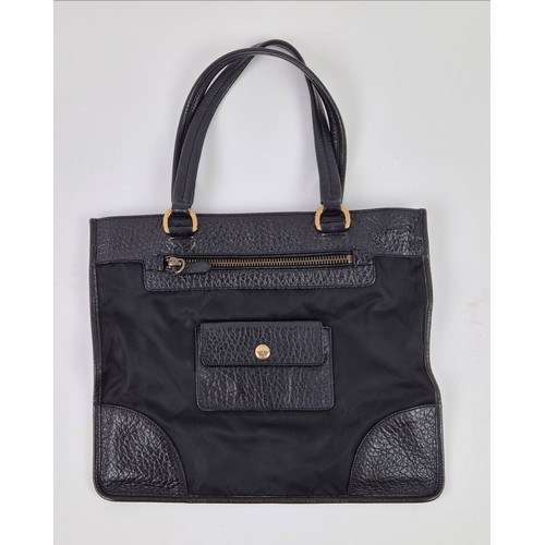 6 - PRADA NYLON BAG, with leather handles and trims, front and back zippered pockets and a further back ... 