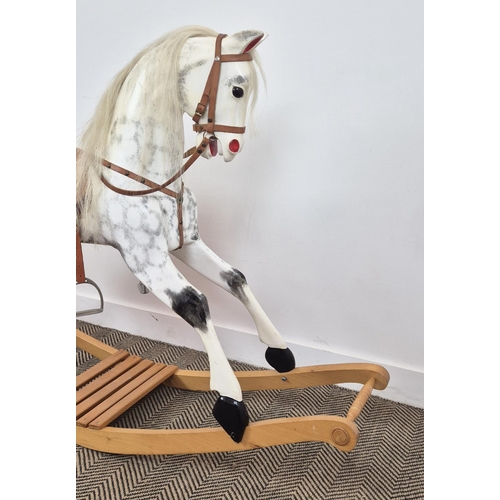 228 - A VICTORIAN STYLE DAPPLED ROCKING HORSE, leather embellishments, horsehair tail and mane, 105cm H x ... 