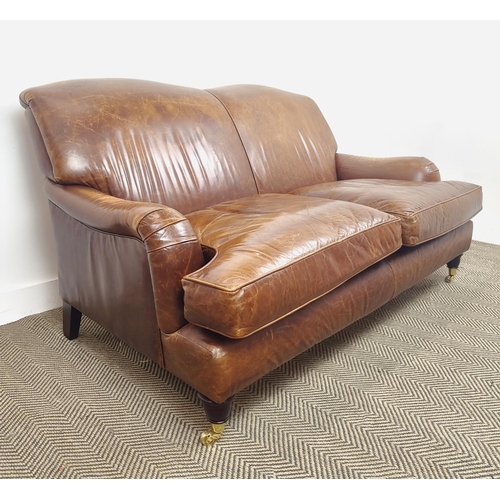 362 - HOWARD STYLE SOFA, brown leather with brass front castors, 90cm H x 160cm W x 97cm D.