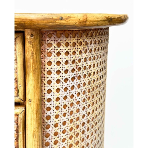 129 - BAMBOO/CANE CHEST, oval bamboo framed and cane panelled with four long drawers, 100cm W x 52cm D x 7... 