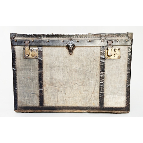 131 - TRAVELLING TRUNK BY J BURTON AND BRO LONDON, early 20th century canvas lined and metal bound with ri... 