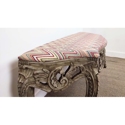 153 - WINDOW SEAT, 'C' scroll carved and grey painted with chevron upholstery, 56cm H x 142cm W x 45cm D.