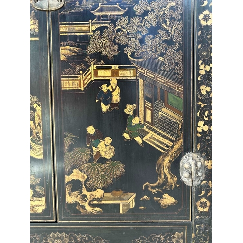 181 - MARRIAGE CABINET, 19th century Chinese lacquered and gilt Chinoiserie decorated with two silver meta... 