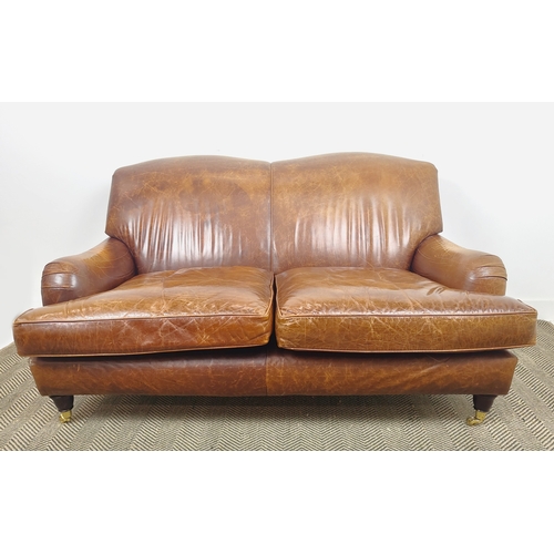 362 - HOWARD STYLE SOFA, brown leather with brass front castors, 90cm H x 160cm W x 97cm D.