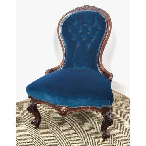 397 - MID VICTORIAN ROSEWOOD NURSING CHAIR, carved crest rail, deep buttoned back, sprung seat, front cabr... 