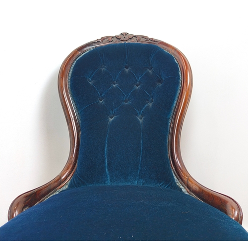 397 - MID VICTORIAN ROSEWOOD NURSING CHAIR, carved crest rail, deep buttoned back, sprung seat, front cabr... 