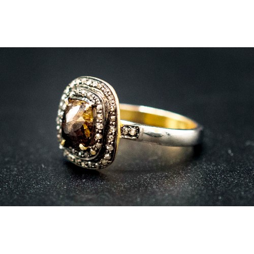 33 - SILVER GILT DRESS RING set with a central fancy brown rose-cut cushion-shaped diamond and two halos ... 