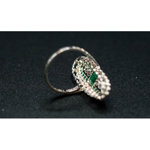 37 - ELONGATED PLATINUM COCKTAIL RING set with emerald-cut and calibre-cut emeralds, and eight-cut diamon... 