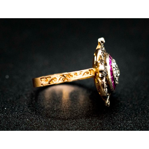 40 - UNHALLMARKED ROSE GOLD SILVER TOPPED ORNATE VICTORIAN STYLE RING SET WITH A CENTRAL OLD CUT DIAMOND,... 