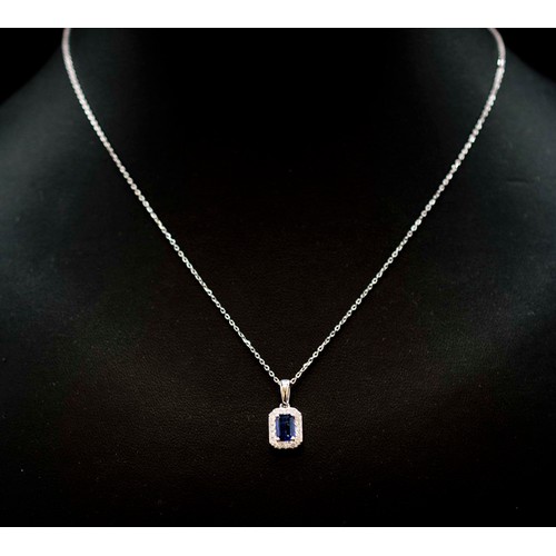 46 - 18CT WHITE GOLD STEP-CUT SAPPHIRE AND RBC DIAMOND CLUSTER PENDANT ON AN 18CT WHITE GOLD CHAIN, boxed... 