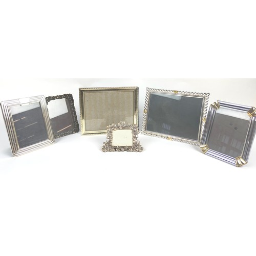 12 - PICTURE FRAMES, six, including a foliate Gorham frame and two Loui Mitchel frames. (6)