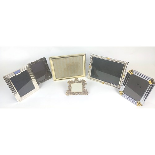 12 - PICTURE FRAMES, six, including a foliate Gorham frame and two Loui Mitchel frames. (6)