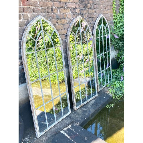 384 - ARCHITECTURAL WALL MIRRORS, a set of three, arched metal frames, 160cm x 67cm. (3)