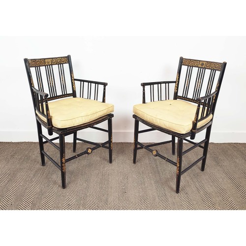 524 - ARMCHAIRS, a pair, Regency ebonised and painted with rush seats and silk squab cushions, 87cm H x 58... 