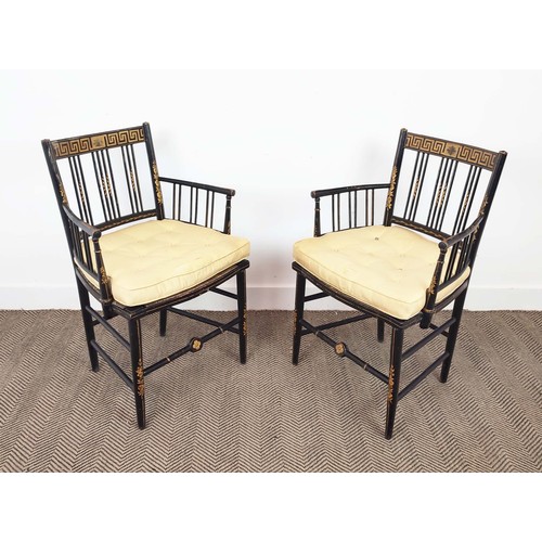 524 - ARMCHAIRS, a pair, Regency ebonised and painted with rush seats and silk squab cushions, 87cm H x 58... 