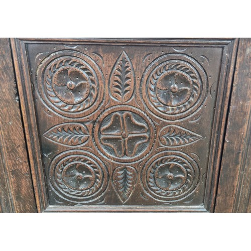 526 - LATE 17TH CENTURY OAK JOINED COFFER, panelled top, front and sides with carved frieze and symmetrica... 