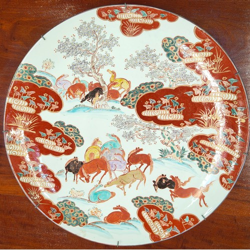 4 - LARGE JAPANESE KUTANI PORCELAIN CHARGER, late 19th century, decorated with grazing horses, character... 