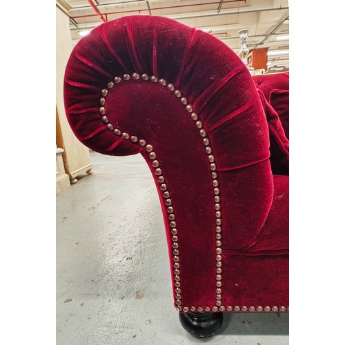 285 - GEORGE SMITH CHESTERFIELD SOFA, in claret buttoned plush upholstery with studded detail, bears plaqu... 