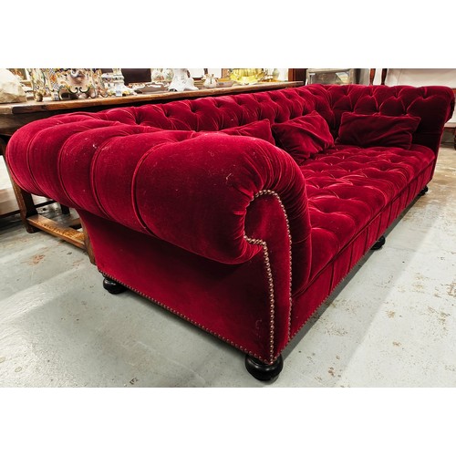 285 - GEORGE SMITH CHESTERFIELD SOFA, in claret buttoned plush upholstery with studded detail, bears plaqu... 