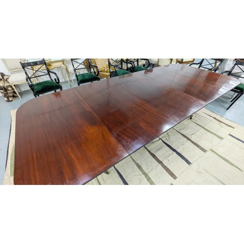 412 - TRIPLE PEDESTAL DINING TABLE, Regency style mahogany with two extra leaves, brass clips and castors,... 