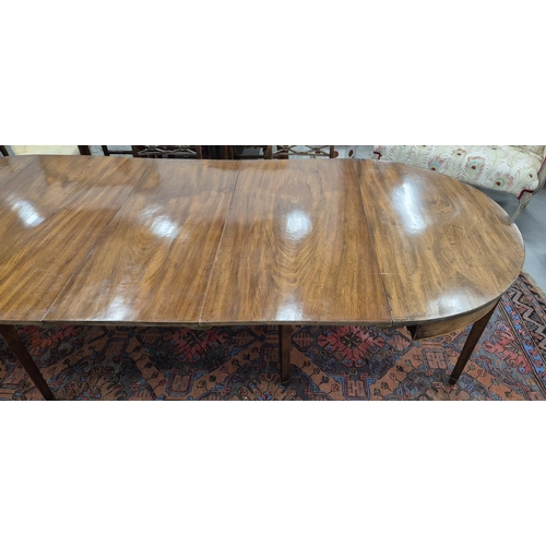 185 - DINING TABLE, George III mahogany and boxwood strung with elliptical ends and three extra leaves, 73... 