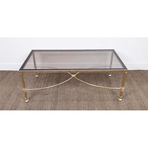 282 - HOLLYWOOD REGENCY MANNER LOW TABLE, brass with rectangular tinted glass top, 42cm H x 112cm W x 57cm... 