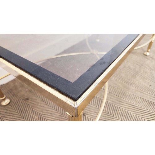 282 - HOLLYWOOD REGENCY MANNER LOW TABLE, brass with rectangular tinted glass top, 42cm H x 112cm W x 57cm... 