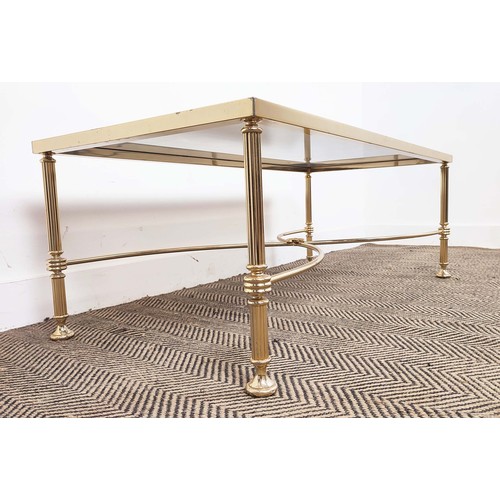 282 - HOLLYWOOD REGENCY MANNER LOW TABLE, brass with rectangular tinted glass top, 42cm H x 112cm W x 57cm... 