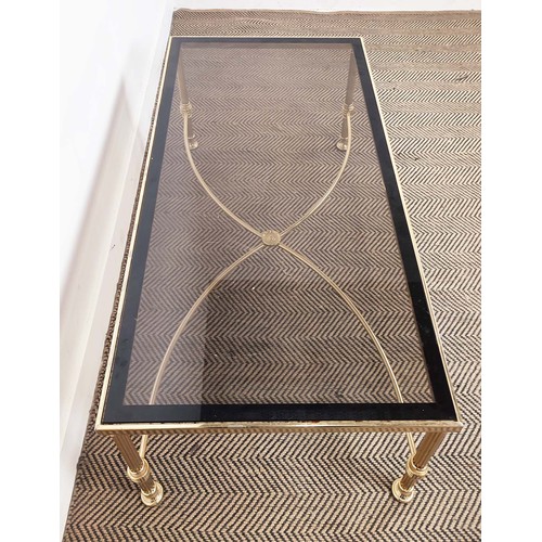 282 - HOLLYWOOD REGENCY MANNER LOW TABLE, brass with rectangular tinted glass top, 42cm H x 112cm W x 57cm... 